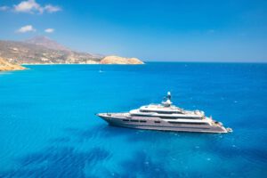 multideck-yacht-in-a-bay-with-azure-water-summer